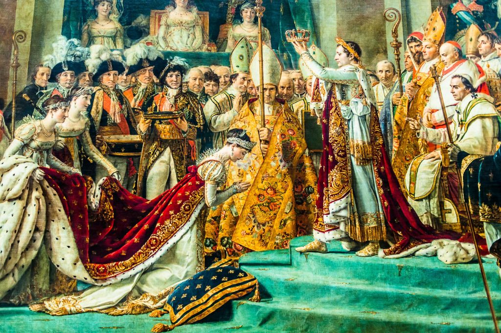 The painting depicts the coronation of Napoleon Bonaparte as Emperor of the French, featuring elaborate attire, ceremonial regalia, and various dignitaries present during the event.
