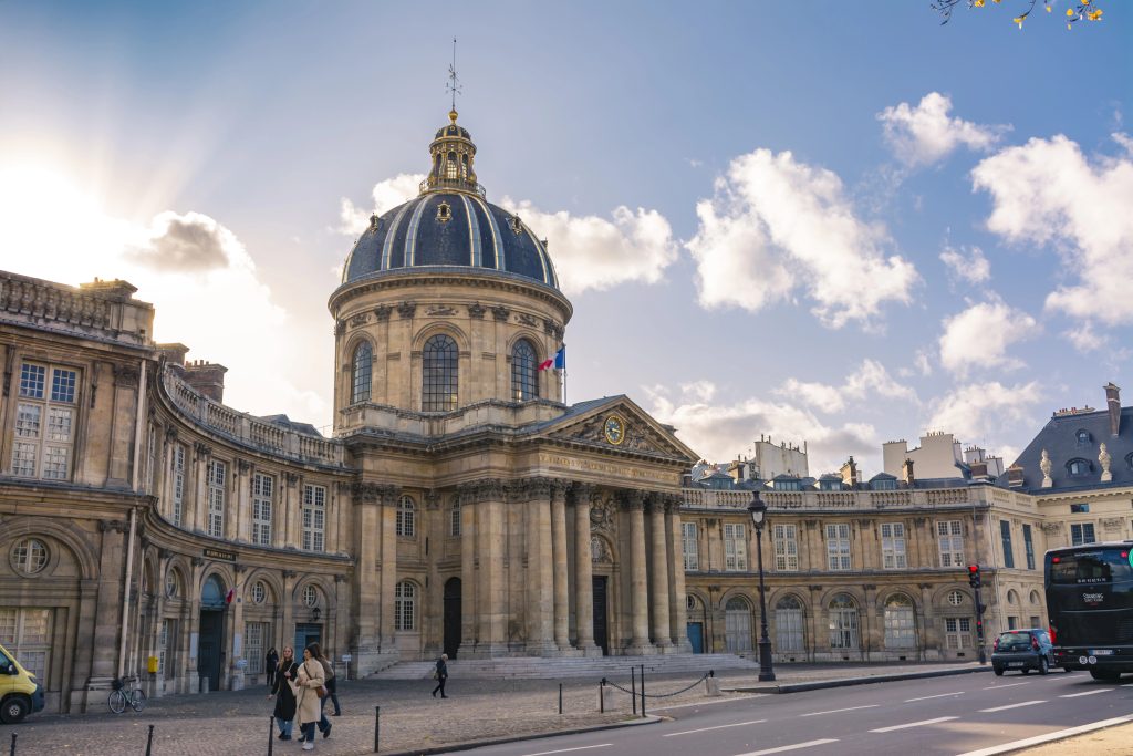 French Institute of Sciences, and the Mazarine library, in front of the bridge of the Arts and the Louvre museum