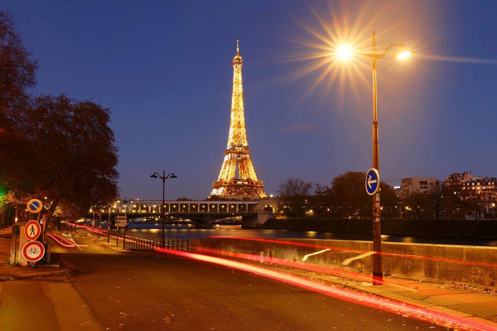 The view of the illuminated Eiffel Tower and the river Seine in Paris France