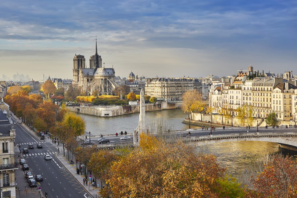 Scenic view of Notre-Dame de Paris with Saint-Louis and Cite islands on a bright fall day