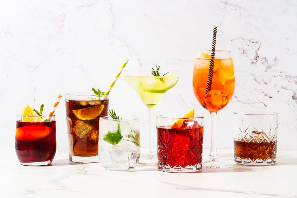 Alcohol party. Different cocktail drinks at white background. Aperol spritz, negroni, Margarita, Cuba libre, jin tonic and sangria.