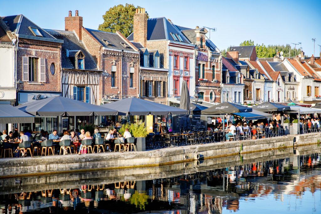 AMIENS, FRANCE: Restaurants in the old town of Amiens, France by sunset.