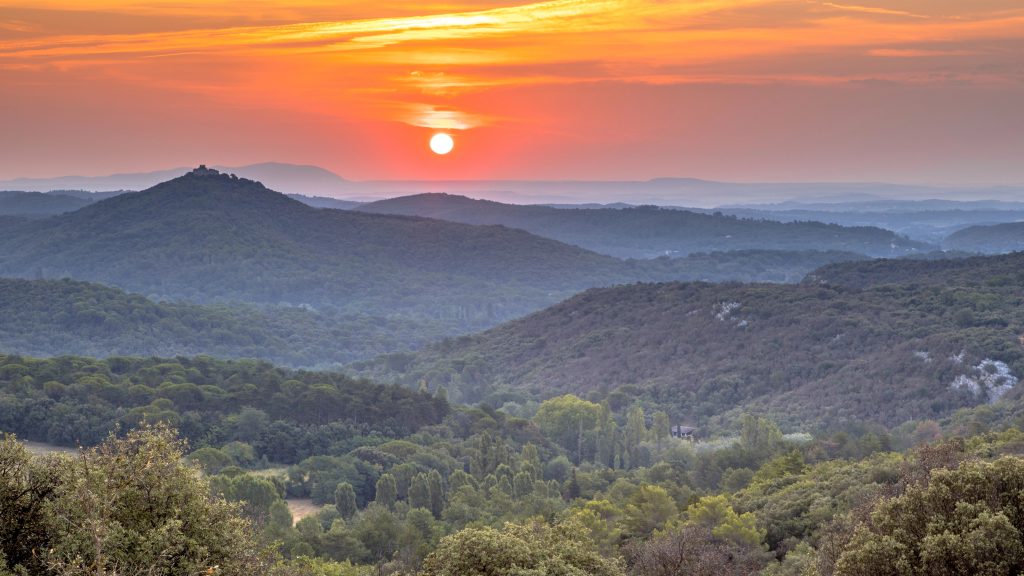 Orange Sunrise over hills of Cevennes national park near Monoblet, Occitanie, Southern France