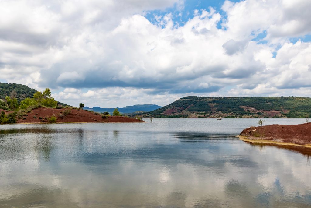 Landscape of red rocks of Lake Salagou (Occitanie, France)