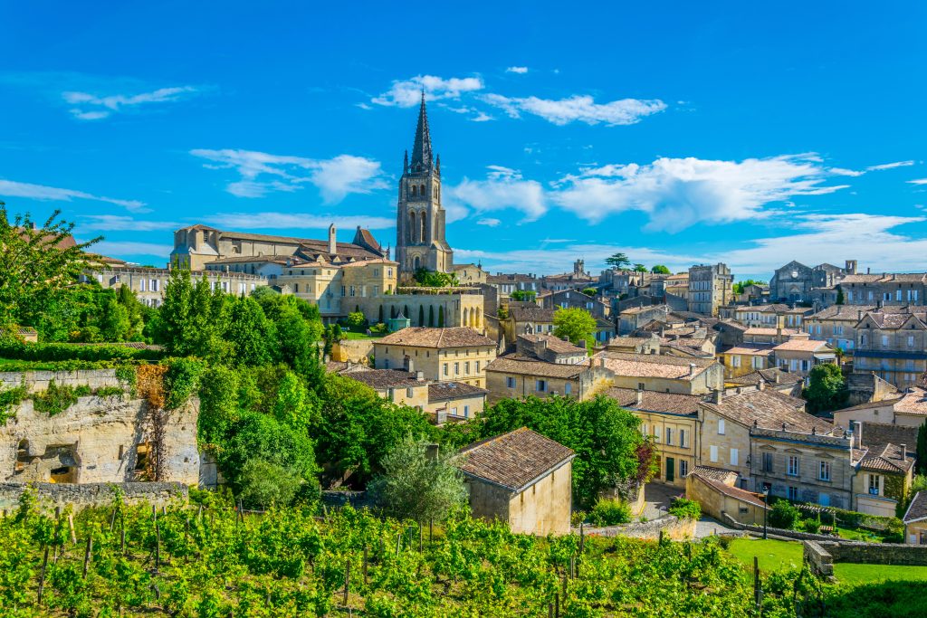 Aerial view of French village Saint Emilion dominated by spire of the monolithic churc