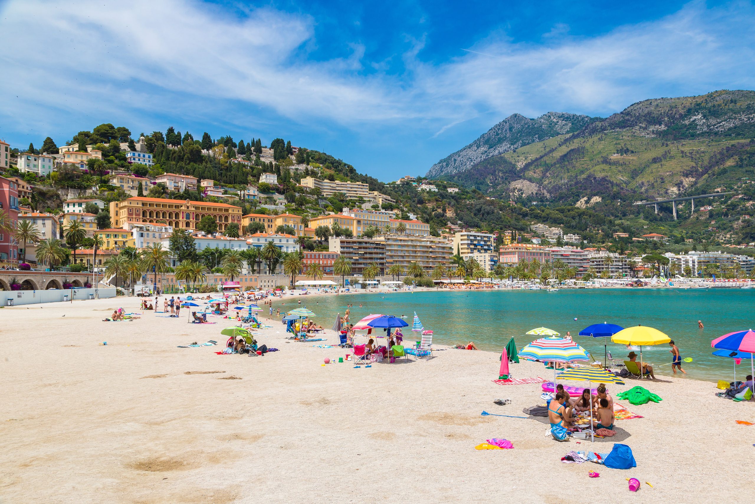 MENTON, FRANCE - JUNE 13, 2016: Colorful old town and beach in Menton on french Riviera in a beautiful