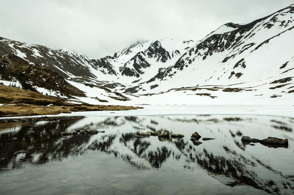 Lake under the Pic Carlit, covered by snow, Pyrenees (France)
