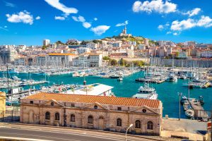 City of Marseille harbor and Notre Dame de la Garde church on the hill view, southern France